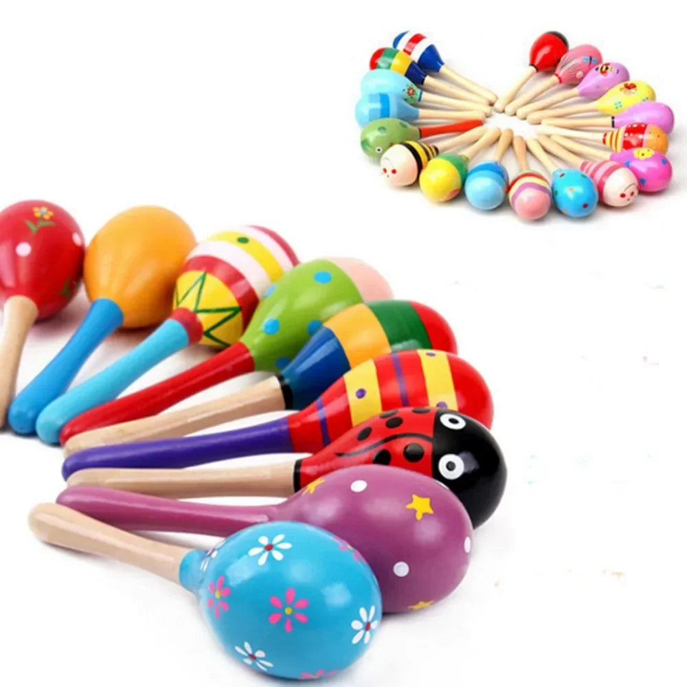 Colorful wooden maracas with animal designs on a white background